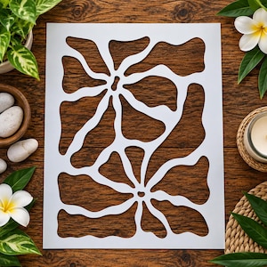 May include: A rectangular white stencil sheet featuring a repeating abstract organic pattern of two large, flowing, flower-like shapes with wavy, interconnected lines and irregular cutouts throughout the entire surface of the material.
