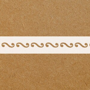 May include: A white stencil with a repeating scroll design on a brown background. The scroll pattern is a series of connected, stylized question mark shapes. The stencil is rectangular and centered horizontally.