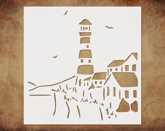 May include: A white stencil featuring a coastal scene. The design includes a lighthouse, several houses, the shoreline, and flying birds. The lighthouse is tall and striped, and the houses have pitched roofs. The stencil is on a brown background.