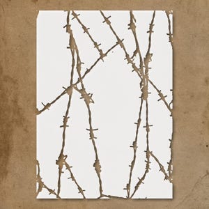May include: A white rectangular card with a brown barbed wire design. The barbed wire pattern is a series of lines with small barbs, creating a visual texture. The card has a torn edge on the right side.