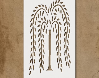 May include: A stencil featuring a weeping willow tree design. The tree is depicted in a simple, stylized manner with a brown trunk and cascading branches with leaves, set against a white background.