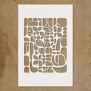 May include: A white paper cut-out with an abstract design of various shapes and sizes. The design is cut out of the paper, revealing a brown background. The shapes include rectangles, ovals, and curved lines, creating a modern, artistic aesthetic.