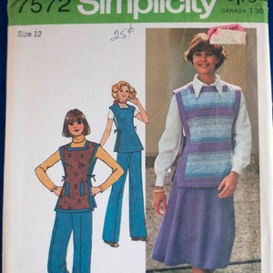 May include: Vintage Simplicity sewing pattern #7572 for a women's vest and skirt or trousers. The pattern includes two different styles, one with a striped vest and the other with a floral print vest. The pattern is for size 12.