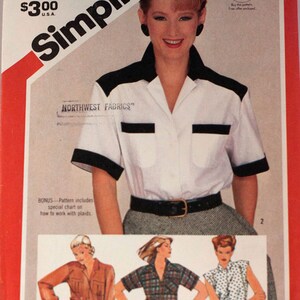 May include: Simplicity sewing pattern 6018, size 12 Miss. The pattern features a woman wearing a white shirt with black accents, a black belt, and a gray skirt. The pattern includes a bonus chart on how to work with plaids. The price is $3.00.
