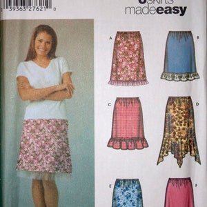 May include: Simplicity sewing pattern number 5100 for six skirts. The pattern includes instructions for making six different styles of skirts, including a straight skirt, a gored skirt, and a tiered skirt. The pattern is for sizes HH, 6, 8, 10, and 12.