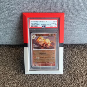 May include: A framed Pok&eacute;mon trading card featuring Arcanine. The card is encased in a clear plastic holder within a red, white, and black frame. The card's text includes "2023 Pokemon SV2a JP" and "Master Ball Reverse Holo."
