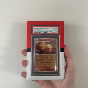 May include: A graded Pok&eacute;mon card of Arcanine in a red, white, and black holder. The card features Japanese text and a colorful illustration of the Pok&eacute;mon. The holder has the text "2023 POKEMON SV2a JP" and "MASTER BALL REVERSE HOLO".