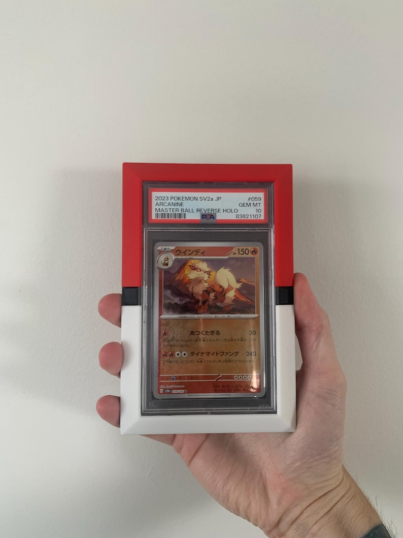 May include: A graded Pok&eacute;mon card of Arcanine in a red, white, and black holder. The card features Japanese text and a colorful illustration of the Pok&eacute;mon. The holder has the text "2023 POKEMON SV2a JP" and "MASTER BALL REVERSE HOLO".