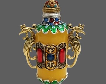 Amberkleurige snuiffles met feniksmotieven: verzamelobject prachtige emailkunst en cultureel erfgoed