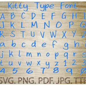 May include: A blue alphabet font with the words "Kitty Type Font" at the top. The letters are handwritten and include numbers 1 through 9 and 0. The letters and numbers are on a woodgrain background. The text "SVG. PNG. PDF. JPG. TTF" is at the bottom of the image.