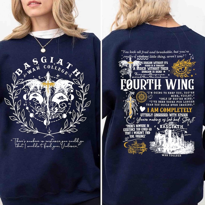 May include: Navy blue sweatshirt with white and gold graphic designs. The front features a sword, wings, and text that reads "BASGIATH WAR COLLEGE." The back displays "FOURTH WING" and additional text. A stylish and comfortable apparel item.