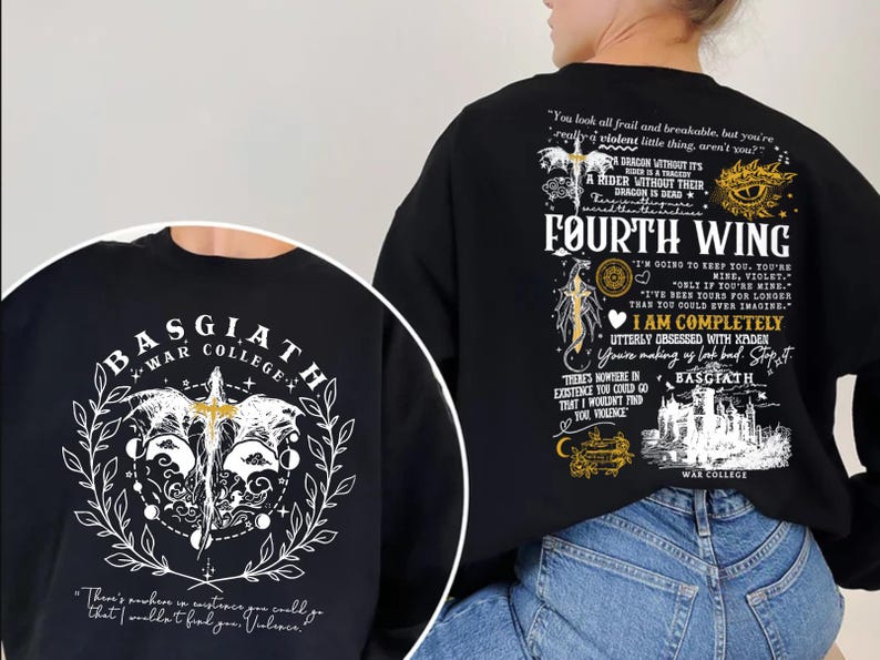 May include: Black sweatshirt featuring the text "FOURTH WING" and "BASGIATH WAR COLLEGE". The design includes a dragon, sword, and other graphic elements in white and gold. The back of the sweatshirt has additional text and illustrations.
