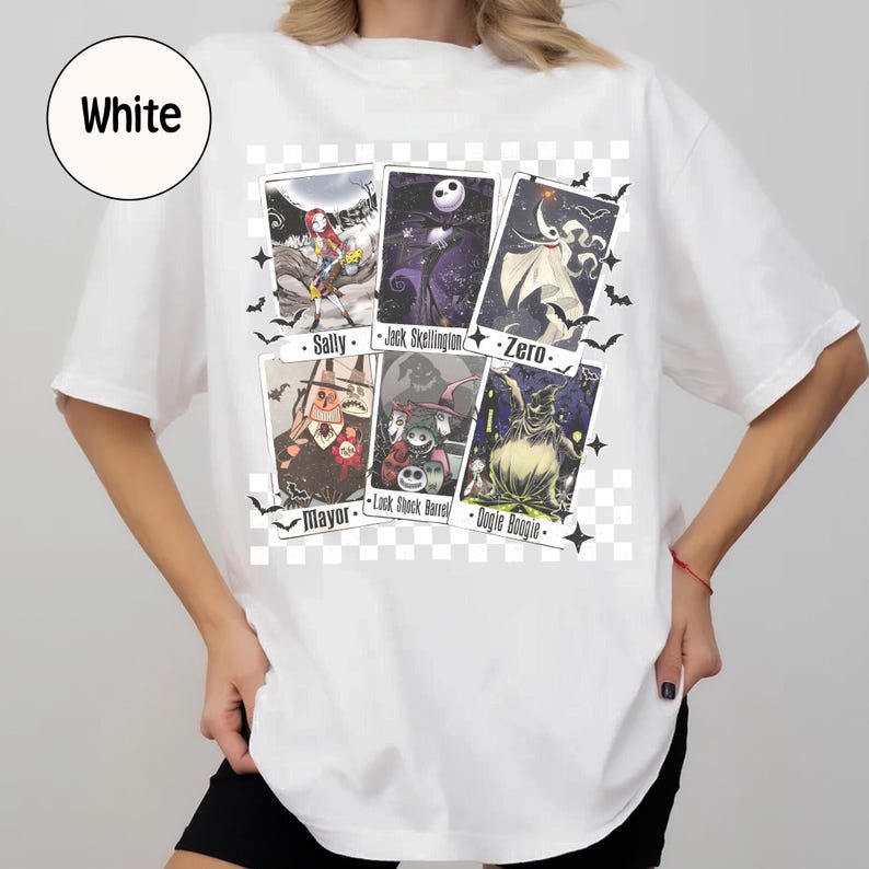 May include: White t-shirt featuring a graphic of characters from The Nightmare Before Christmas. The design includes images of Sally, Jack Skellington, Zero, the Mayor, Lock, Shock, Barrel, and Oogie Boogie. Bats and stars are also included.