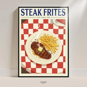May include: A framed art print featuring a vintage-style illustration of steak frites. The image shows a plate with a grilled steak topped with butter and a side of french fries, set against a red and white checkered background. The text "STEAK FRITES" is at the top.