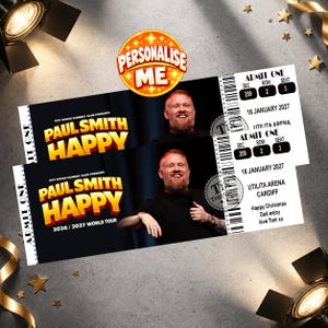 May include: Two rectangular event tickets for a Paul Smith Happy comedy show. The tickets feature a photo of a man with a red beard, the text Hot Water Comedy Club Presents Paul Smith Happy 2026/2027 World Tour, and details for Utilita Arena Cardiff.