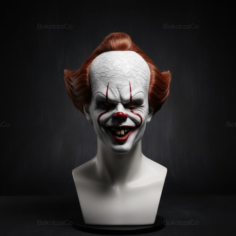 May include: A white bust of a scary clown with red hair, a white forehead, and a sinister grin. The clown has red markings around the eyes and mouth, and a red nose. The bust is set against a dark background.