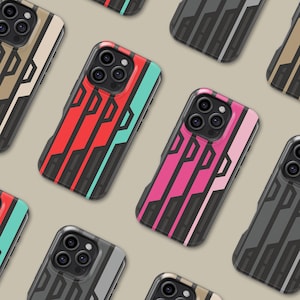 May include: A collection of smartphone cases with a geometric design. The cases feature a variety of colors, including red, pink, teal, and gray, with black accents. The cases are arranged on a neutral background.