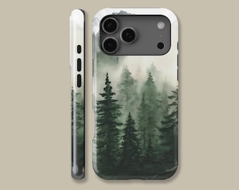 May include: A phone case with a watercolour painting of a misty forest with tall green trees. The case has a white border and a side view showing the phone's buttons. The design wraps around the edges.