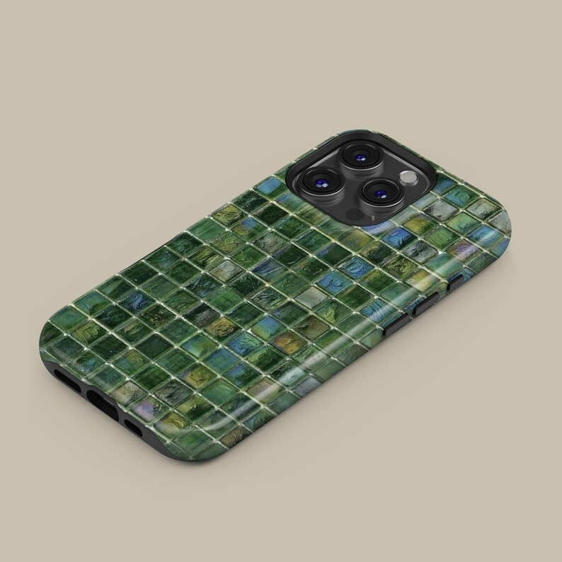 May include: A phone case for an iPhone with a green and blue mosaic pattern.