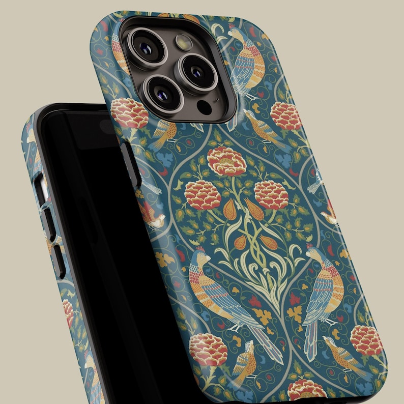 May include: A teal phone case featuring a repeating pattern of colorful birds, flowers, and foliage. The design includes orange, yellow, and blue birds, with red and orange flowers. The case is shown on a black phone.