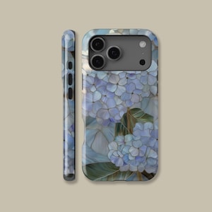 May include: A phone case featuring a blue hydrangea floral design. The case has a glossy finish and a wraparound design with a side view showing the floral pattern. The case is designed to fit a smartphone.