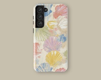 May include: A phone case featuring a repeating pattern of colorful seashells in shades of pink, yellow, blue, and green. The design is set against a cream-colored background. The case has a camera and button cutouts.