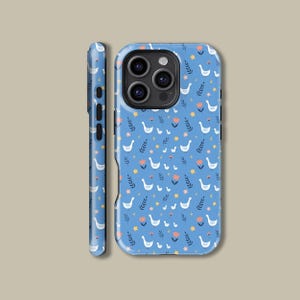 May include: A blue phone case featuring a repeating pattern of white geese, orange flowers, and green leaves. The case is shown from multiple angles, including the side profile, showcasing the design's wrap-around nature.