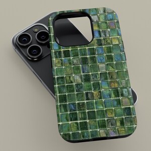 May include: A green and blue mosaic tile phone case for an iPhone. The case has a black border and a camera cutout.