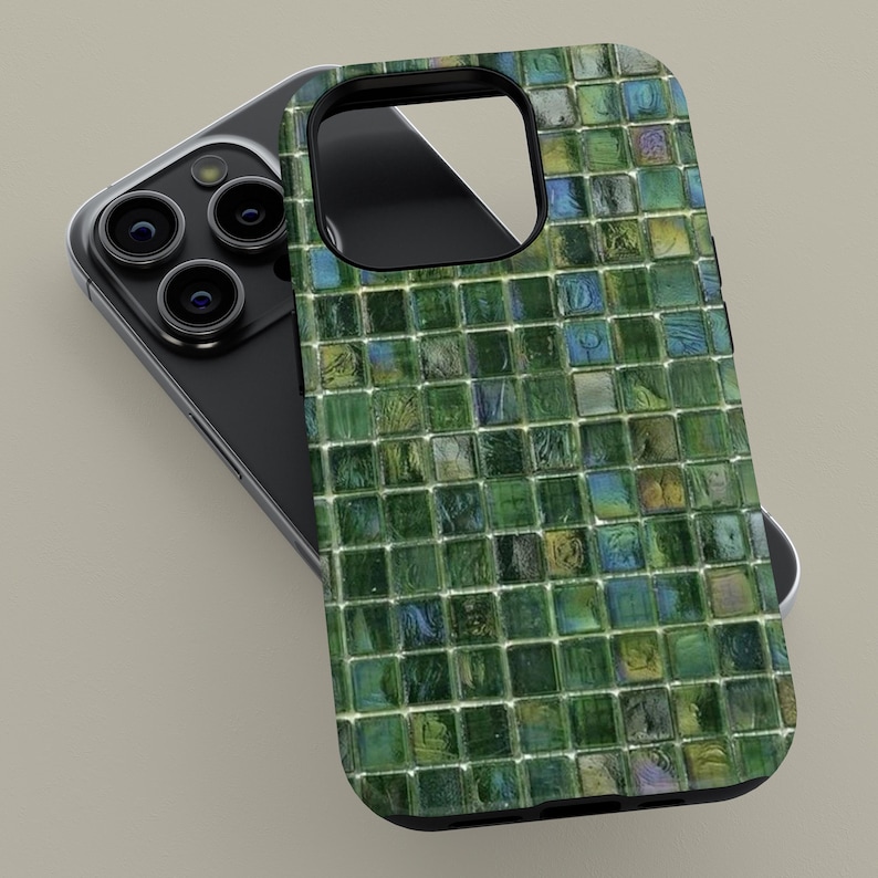 May include: A green and blue mosaic tile phone case for an iPhone. The case has a black border and a camera cutout.