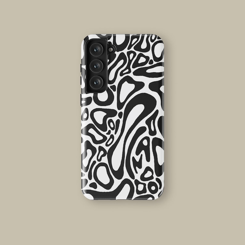 May include: A black and white phone case with a repeating abstract pattern. The design features organic shapes and lines in a high-contrast style. The case has a camera module with three lenses.