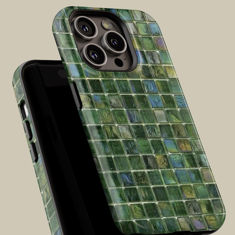 May include: A green and blue mosaic patterned phone case for an iPhone. The case has a raised camera bump and a cutout for the phone's buttons.