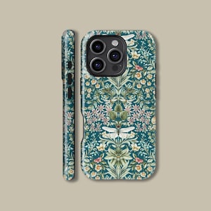 May include: A teal phone case with a floral pattern featuring white, pink, and yellow flowers, and green leaves. The case has a detailed design with a symmetrical arrangement of botanical elements. The side of the case is also visible, showing the same pattern.