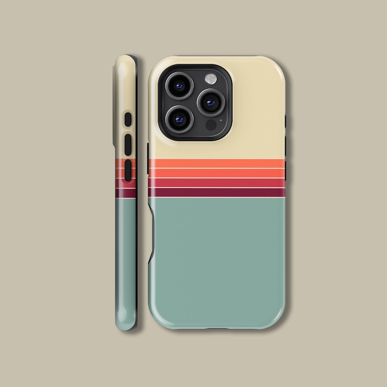 May include: A phone case with a retro design. The top section is cream-coloured, with three horizontal stripes in orange and red. The bottom section is a muted teal colour. The side of the case is teal with red accents.