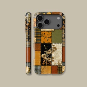 May include: A phone case with a patchwork design, incorporating floral, plaid, and solid patterns in brown, yellow, green, and black. The case has a protective bumper and covers the phone's back and sides, with a matching design on the side.