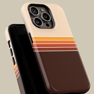May include: A beige and brown phone case with a retro design. The case features horizontal stripes in shades of orange and brown, with a solid brown bottom section. The phone case is designed to fit a smartphone.