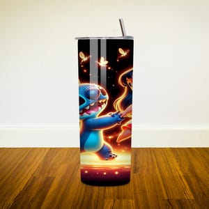 May include: A stainless steel tumbler with a black background and a colourful image of Stitch and Lilo from the Disney movie Lilo & Stitch. The image shows Stitch and Lilo holding hands and surrounded by glowing lights.