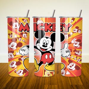 May include: A red and yellow stainless steel tumbler with a Mickey Mouse design. The tumbler features a cartoon image of Mickey Mouse with the word "Mickey" printed above him. The background is a yellow and red pattern of Mickey Mouse heads.