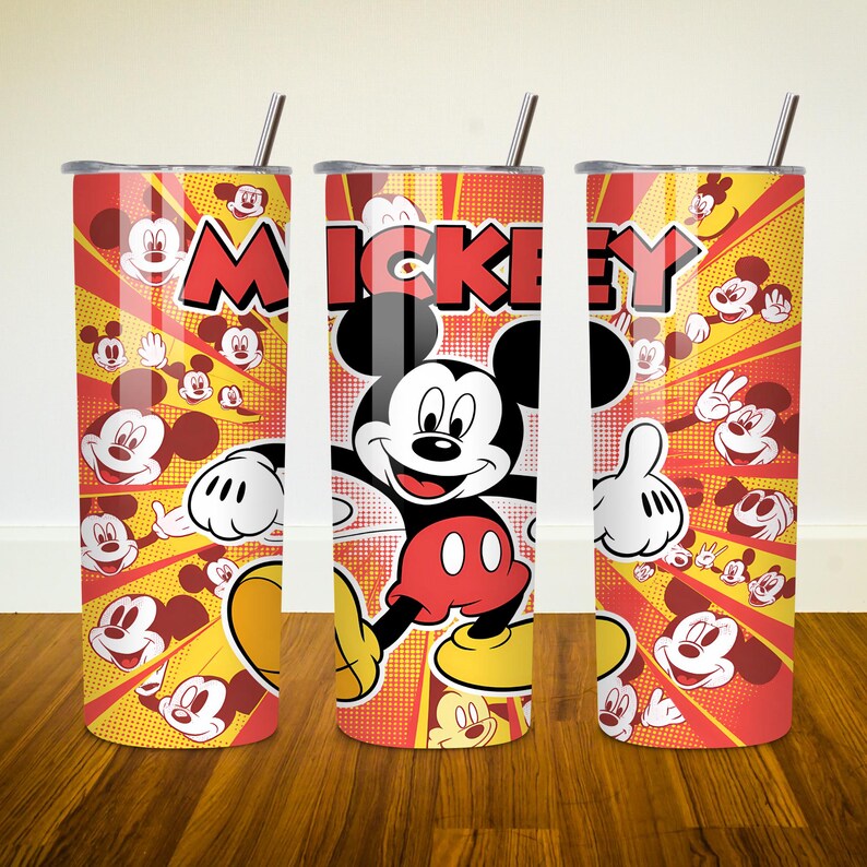 May include: A red and yellow stainless steel tumbler with a Mickey Mouse design. The tumbler features a cartoon image of Mickey Mouse with the word "Mickey" printed above him. The background is a yellow and red pattern of Mickey Mouse heads.