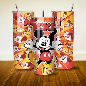 May include: Three red and yellow stainless steel tumblers with a Mickey Mouse design. The tumblers feature a cartoon image of Mickey Mouse with the word "Mickey" printed in large letters. The background is a red and yellow pattern with Mickey Mouse faces.