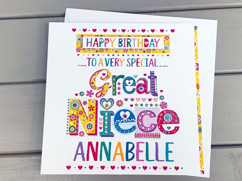 May include: A colorful birthday card for a great niece, featuring the words "Happy Birthday" and "Great Niece Annabelle." The card has a white background with decorative floral and heart accents. Includes a matching envelope.