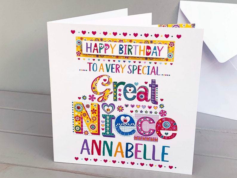 May include: A colorful birthday card for a great niece named Annabelle. The card features the words "Happy Birthday" and "To a very special Great Niece" in a variety of fonts and colors, with decorative hearts and floral accents.