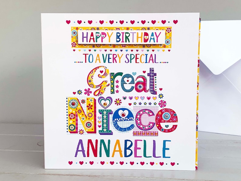 May include: A colorful birthday card for a great niece, featuring the text "Happy Birthday" and "To a very special Great Niece Annabelle." The card has a white background with decorative floral and heart accents.