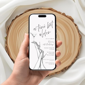 May include: A smartphone displays a birthday invitation with the text "a tini bit older." The invitation features a martini glass, high heels, and the details for Olivia's 20th birthday party, including the date, time, and location.