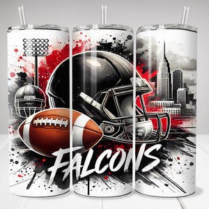 May include: Three white insulated tumblers with a football theme. Each tumbler features a black football helmet, a brown football, and the word "FALCONS" in white. The design includes red and black splatter effects and a city skyline.