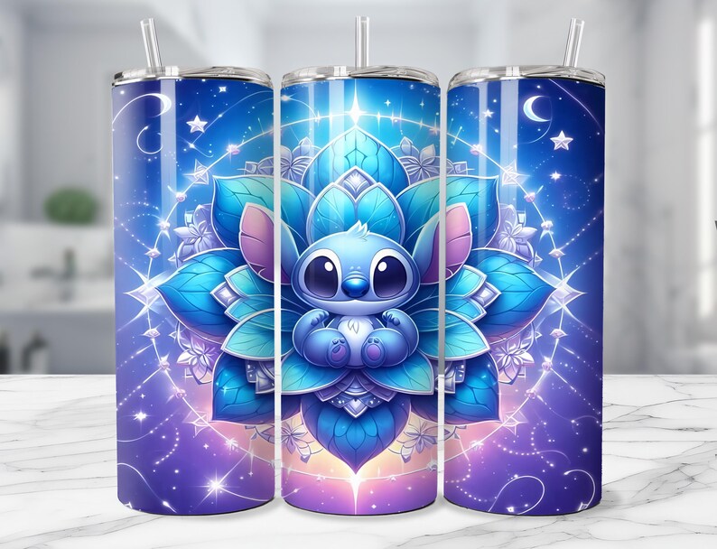 May include: Three stainless steel tumblers with a celestial design featuring a blue cartoon character inside a lotus flower. The tumblers have a blue and purple gradient background with stars and a crescent moon.