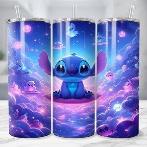 May include: A set of three stainless steel tumblers with a vibrant, cartoon-style design. The design features a blue alien character, surrounded by a dreamy, purple and blue landscape with floating orbs and creatures. Each tumbler has a silver straw.