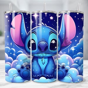 May include: A set of three stainless steel tumblers featuring a cartoon character design. The design showcases a blue alien character with large ears and eyes, set against a starry night sky background with fluffy clouds. Each tumbler includes a straw.