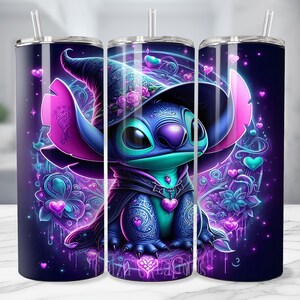 May include: A set of three stainless steel tumblers with a vibrant, cartoon-style illustration of a blue alien character wearing a witch hat. The design features hearts, flowers, and a dark purple background with a straw.