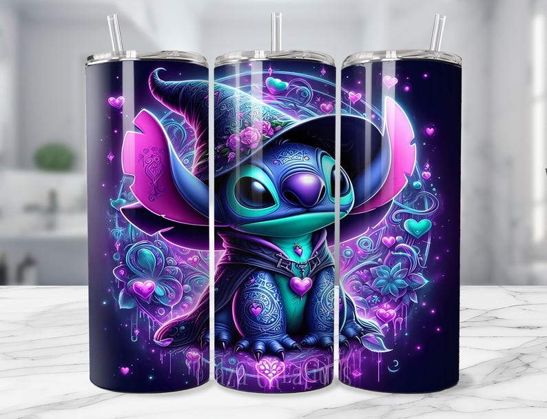 May include: A set of three stainless steel tumblers with a vibrant, cartoon-style illustration of a blue alien character wearing a witch hat. The design features hearts, flowers, and a dark purple background with a straw.