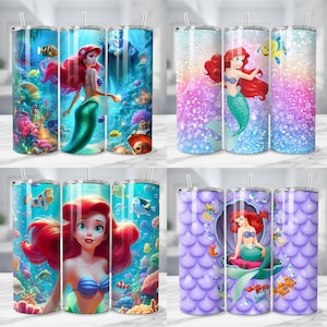 May include: A collection of four stainless steel tumblers featuring mermaid-themed designs. The tumblers showcase vibrant illustrations of mermaids, sea creatures, and underwater scenes in shades of blue, purple, and pink. Each tumbler includes a straw.